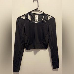 Sports upper ( training wear), brand decathlon and color is black.